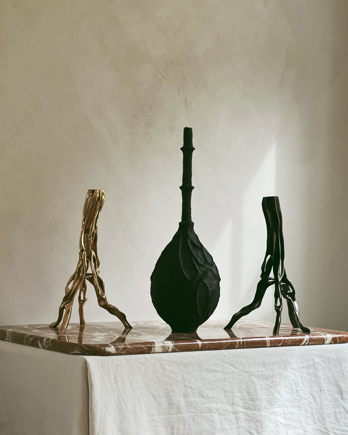 Candlestick in Polished Bronze by Fakasaka with other sculptures