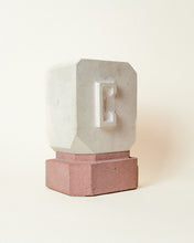 Load image into Gallery viewer, Vintage carved stone block head sculpture in a modernist style. Featuring a contrasting stone base and porous finish. Sourced in the United Kingdom. 
