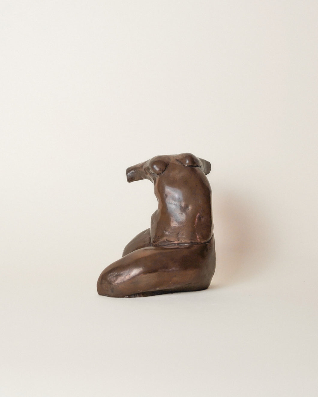 Explore is a cast bronze sculpture of the female form by Artist Dorri Buchholtz. Her body is writing; tension is palpable in her arched back and contorted legs.